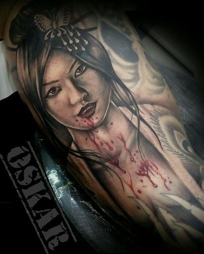 Colored horror style forearm tattoo of bloody Asian geisha