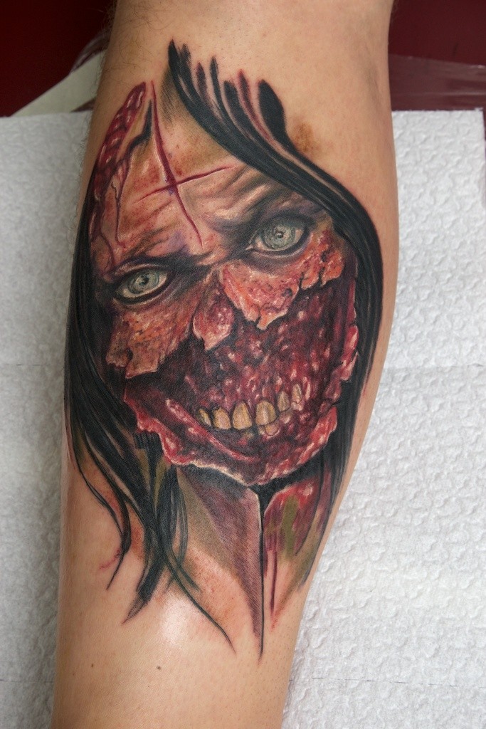 Colored horror style impressive looking zombie woman face tattoo