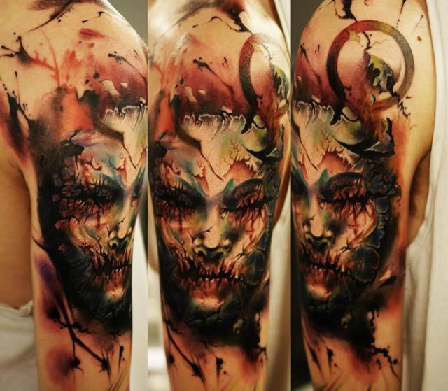 Colored horror style large shoulder tattoo of mystical face