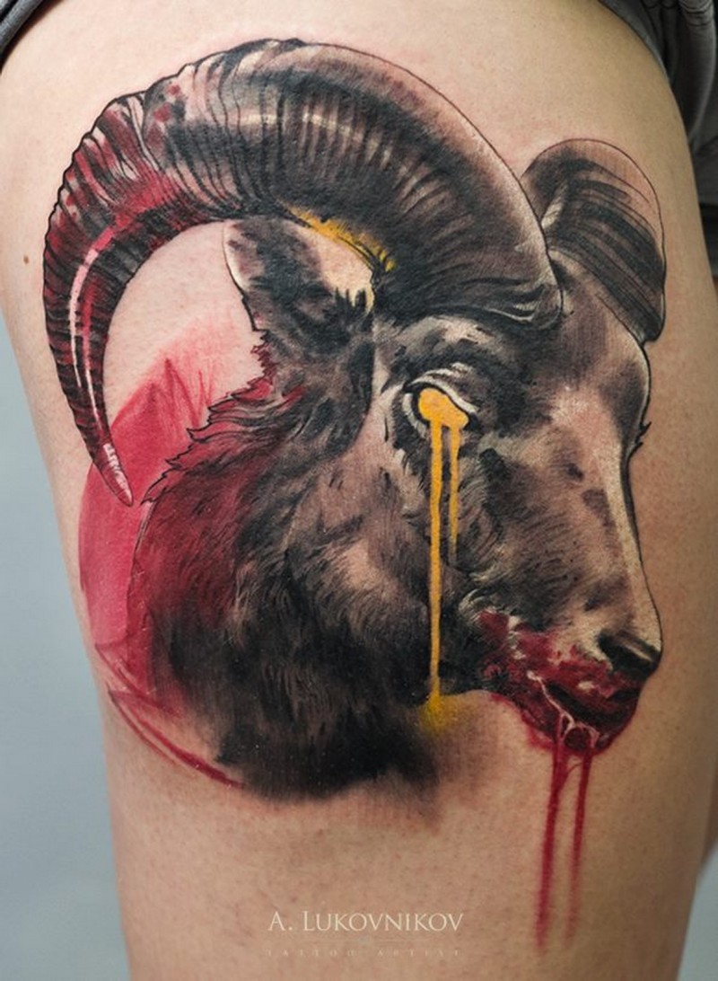Colored horror style terrifying thigh tattoo of bloody goat head