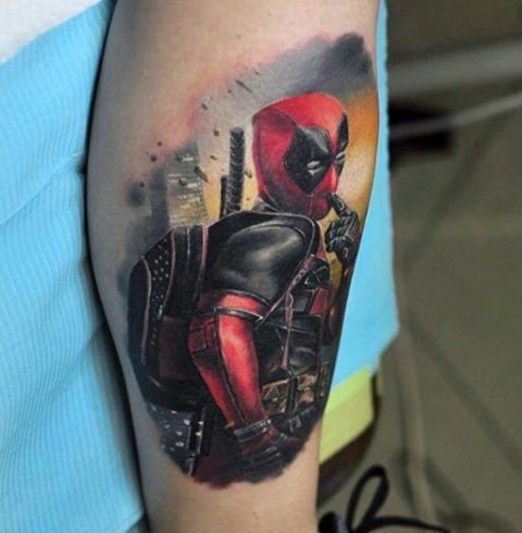 Colored illustrative style arm tattoo of Deadpool with city