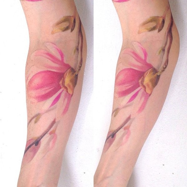 Colored illustrative style arm tattoo of pink flower