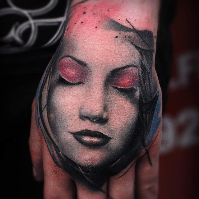 Colored illustrative style hand tattoo of sleeping woman