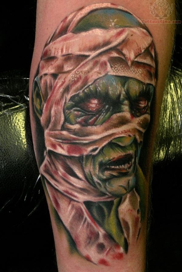 Colored illustrative style leg tattoo of creepy mummy