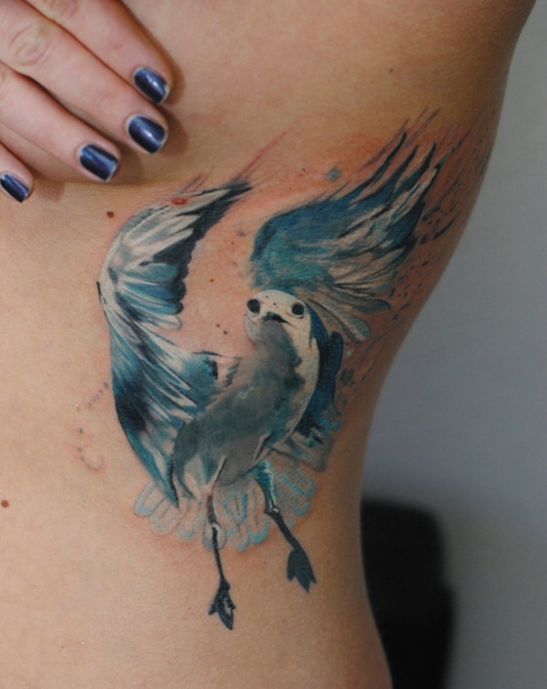 Colored illustrative style side tattoo of beautiful pigeon