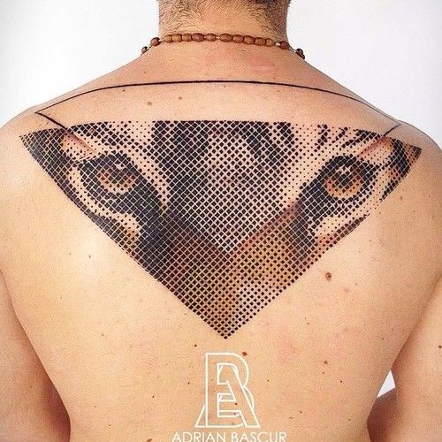 Colored illustrative style upper back tattoo of tiger face