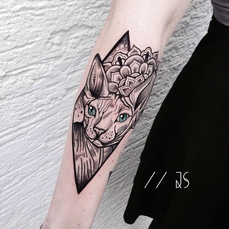 Colored incredible looking arm tattoo of Spinx cat with flowers