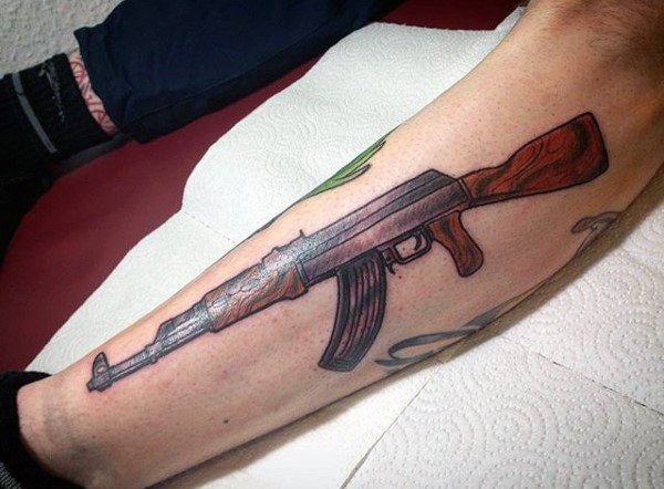 Colored leg tattoo of detailed AK rifle