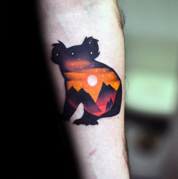 Colored medium size forearm tattoo of koala bear stylized with mountains