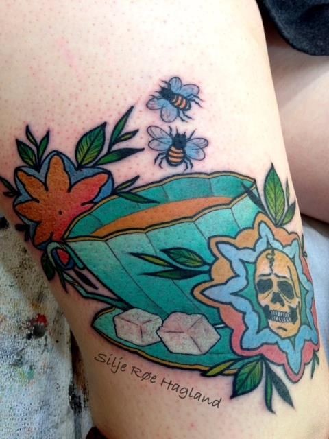 Colored medium size leg tattoo of tea cup with bees and flowers