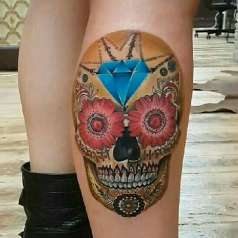 Colored Mexican style leg tattoo of human skull with diamond and flowers
