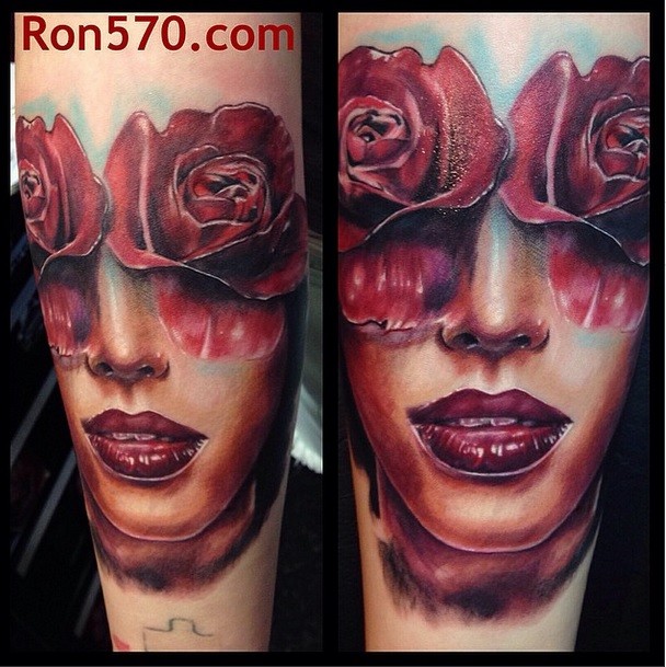 Colored mystical new school style forearm tattoo of woman&quots face with flowers instead of eyes