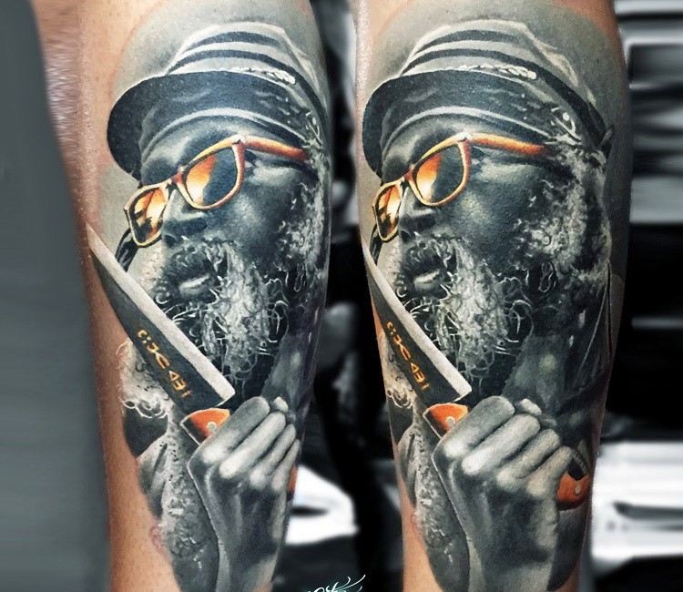 Colored new school style arm tattoo of man with golden glasses and knife