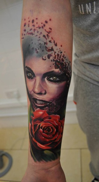 Colored new school style forearm tattoo of vampire woman with rose