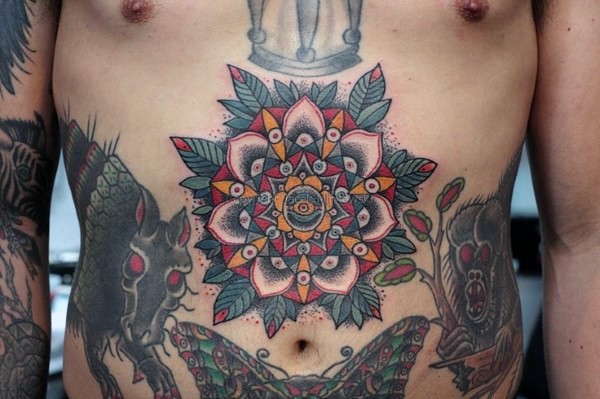 Colored old school style large flower tattoo on belly