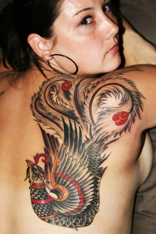 Colored phoenix tattoo on shoulder blade