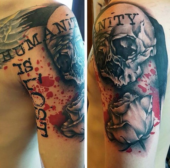 Colored photoshop style shoulder tattoo of human skull with lettering and rose