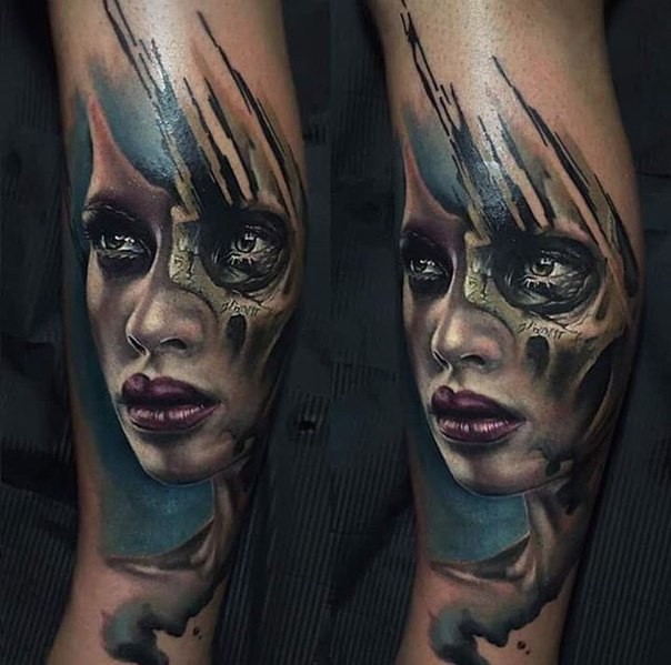 Colored realism style forearm tattoo of woman with skull