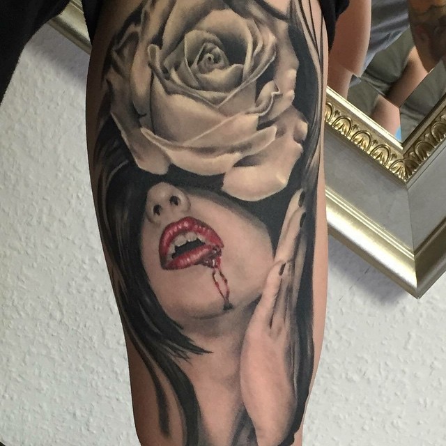 Colored realism style tattoo of bloody woman mouth and rose