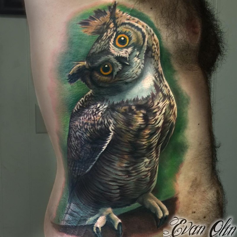 Colored realistic looking side tattoo of cute looking owl
