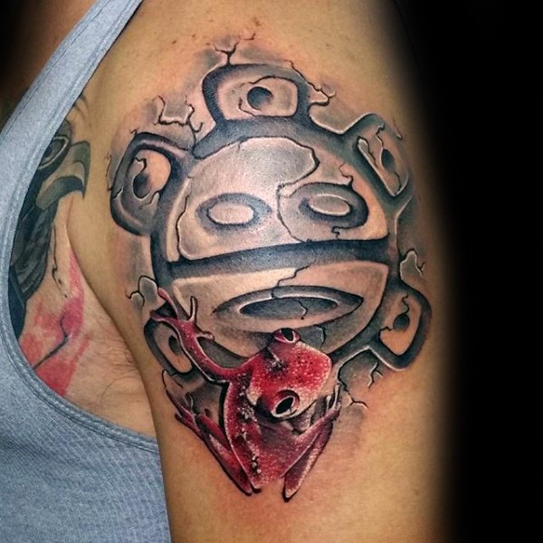 Colored shoulder tattoo of antic symbol with red frog