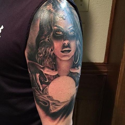 Colored shoulder tattoo of mystical woman with magical orb
