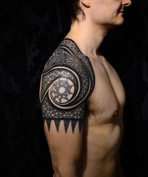 Colored shoulder tattoo of various Celtic ornaments