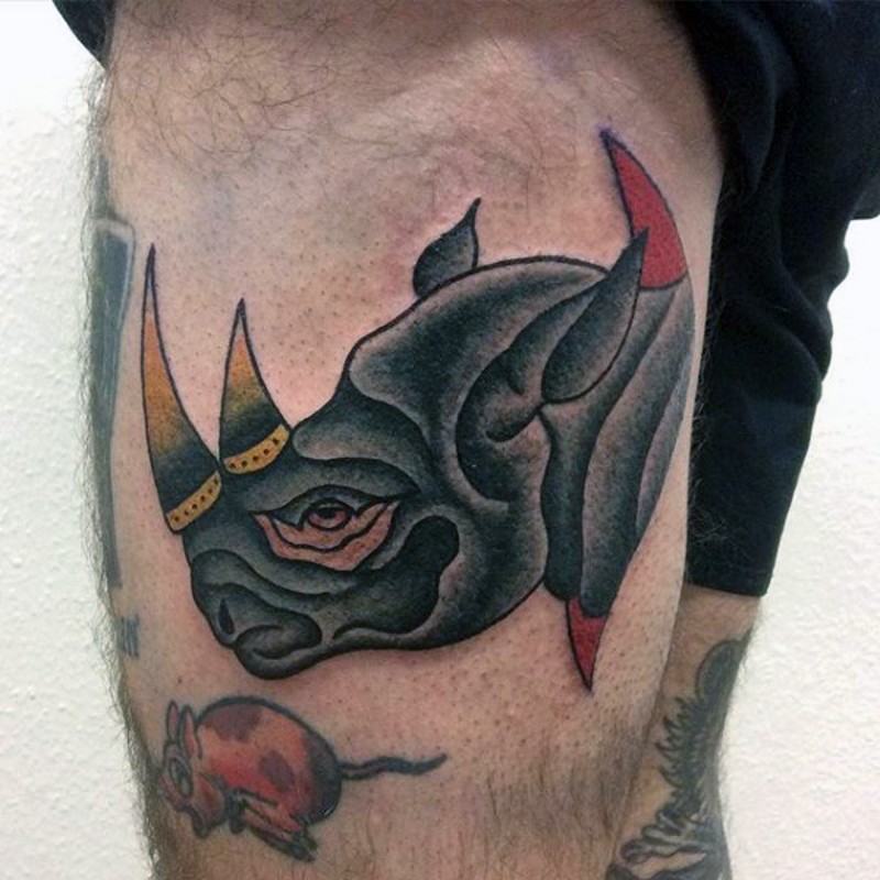 Colored small old school thigh tattoo of rhino head