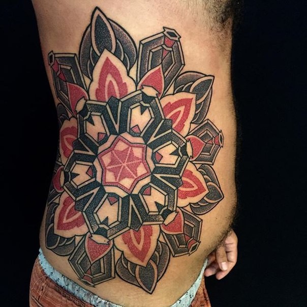 Colored stippling style side tattoo of big flower