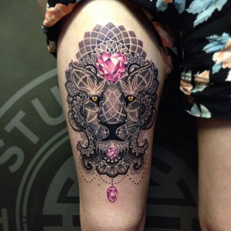 Colored stippling style thigh tattoo of lion face with ornaments and diamonds