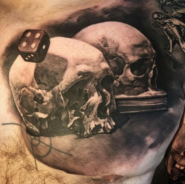 Colored tattoo of human skull with dice