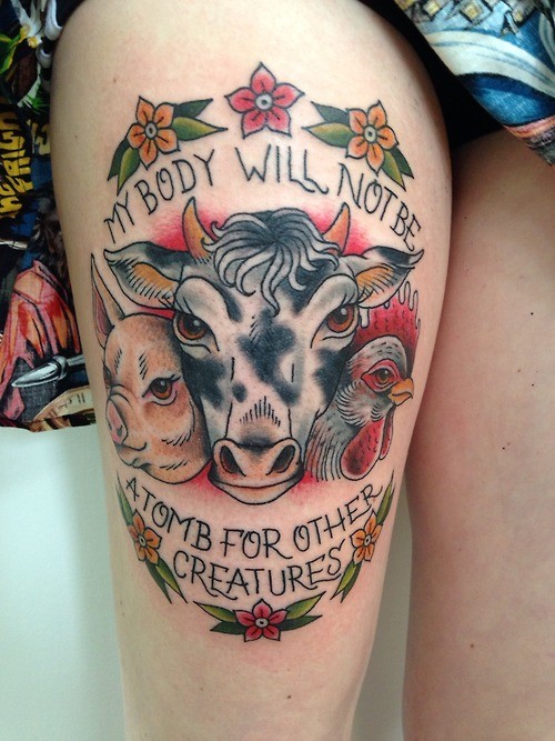 Colored typical old school style thigh tattoo of funny farm animals with lettering and flowers
