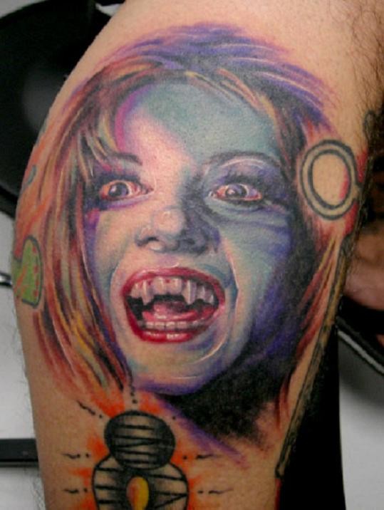 Colored vampire girl tattoo on thigh