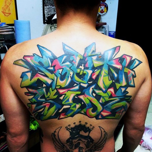 Colored whole back tattoo of graffiti lettering