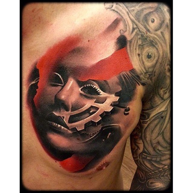 Colored woman face tattoo on chest with mechanism