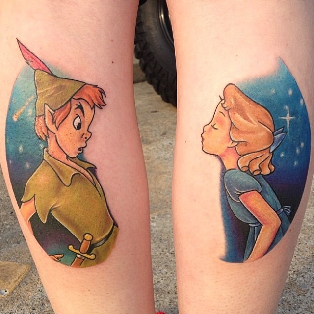 Colorfil cartoon style legs tattoo of Peter Pan heroes