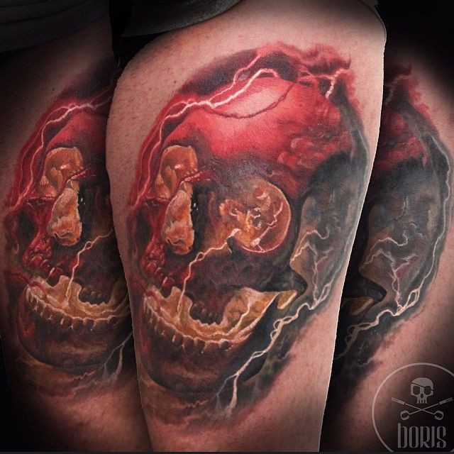Colorful amazing looking thigh tattoo of big skull and lightning