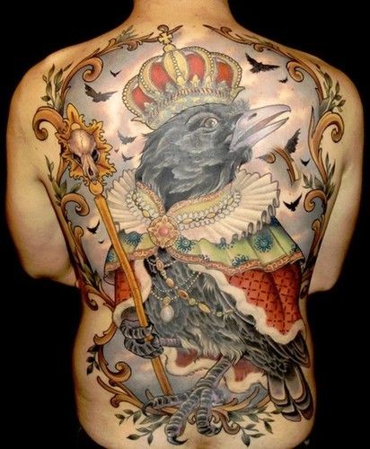 Colorful big crow in royal mantle and crown tattoo on back
