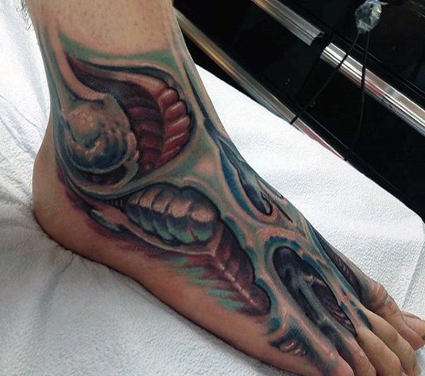Colorful biomechanical leg tattoo on foot