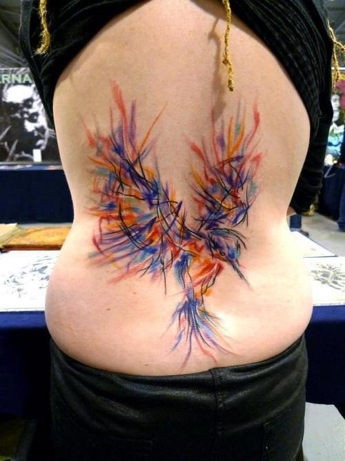 Colorful bird tattoo on back