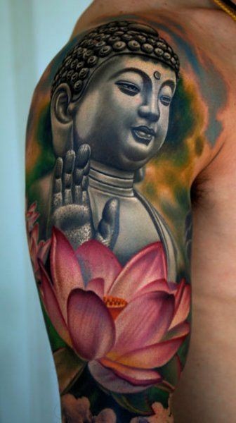 Colorful buddha and lotus flower tattoo on arm