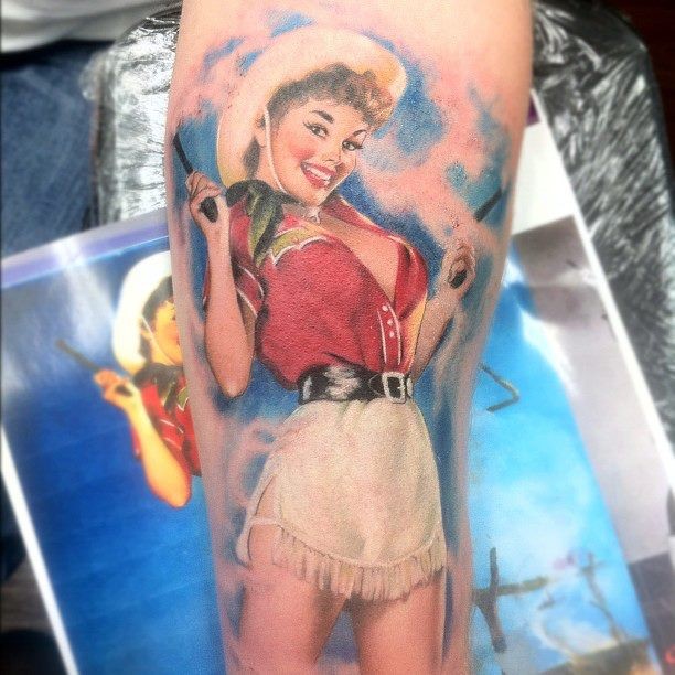 Colorful cowgirl pinup tattoo by Samantha Ford