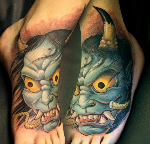 Colorful demon tattoo on feet by Tim Senecal Oni