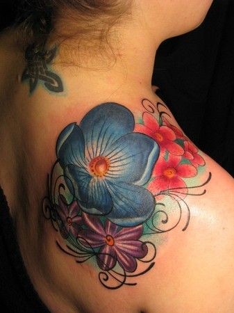 Colorful flowers tattoo on shoulder
