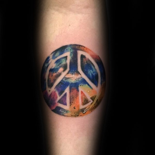 Colorful forearm tattoo of pacific symbol with space
