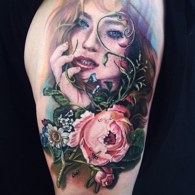 Colorful illustrative style tattoo of seductive woman with wildflowers