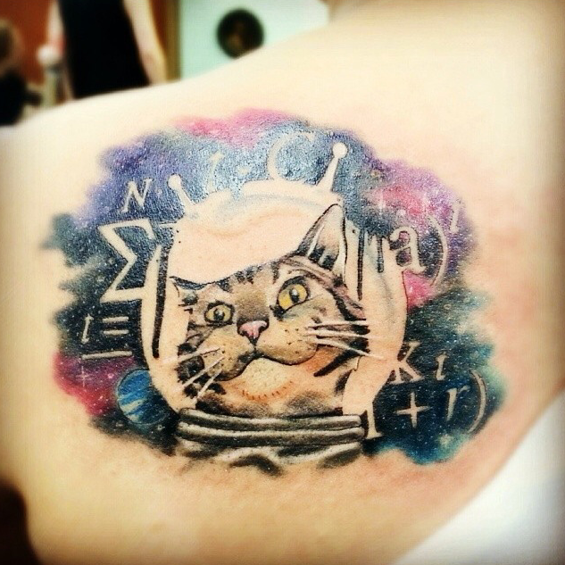 Colorful interesting looking scapular tattoo of scientific cat with lettering