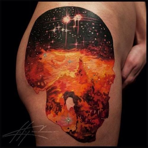 Colorful lovely cosmos skull tattoo on thigh
