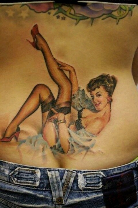 Colorful lovely pinup girl tattoo on back