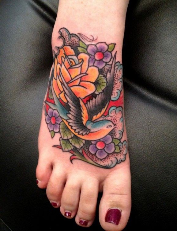 Colorful old school swallow tattoo on foot by Luke Wessman